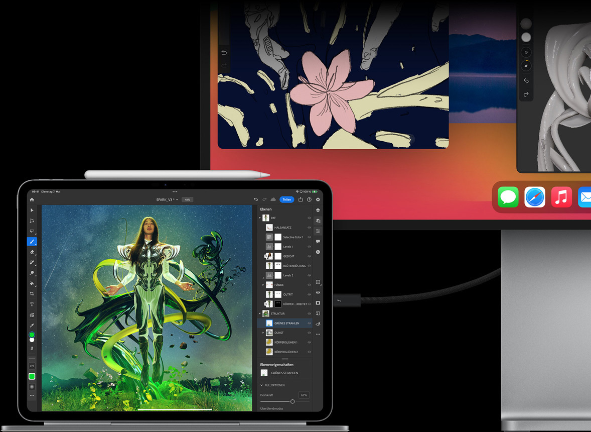 Ein iPad Pro ist im Querformat am Magic Keyboard befestigt, ein externes Display ist angeschlossen, auf beiden werden Bilder bearbeitet