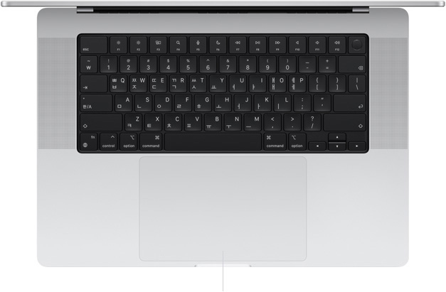 키보드와 그 아래의 Force Touch 트랙패드가 보이도록 MacBook Pro 16을 열어놓고 위에서 내려다본 모습