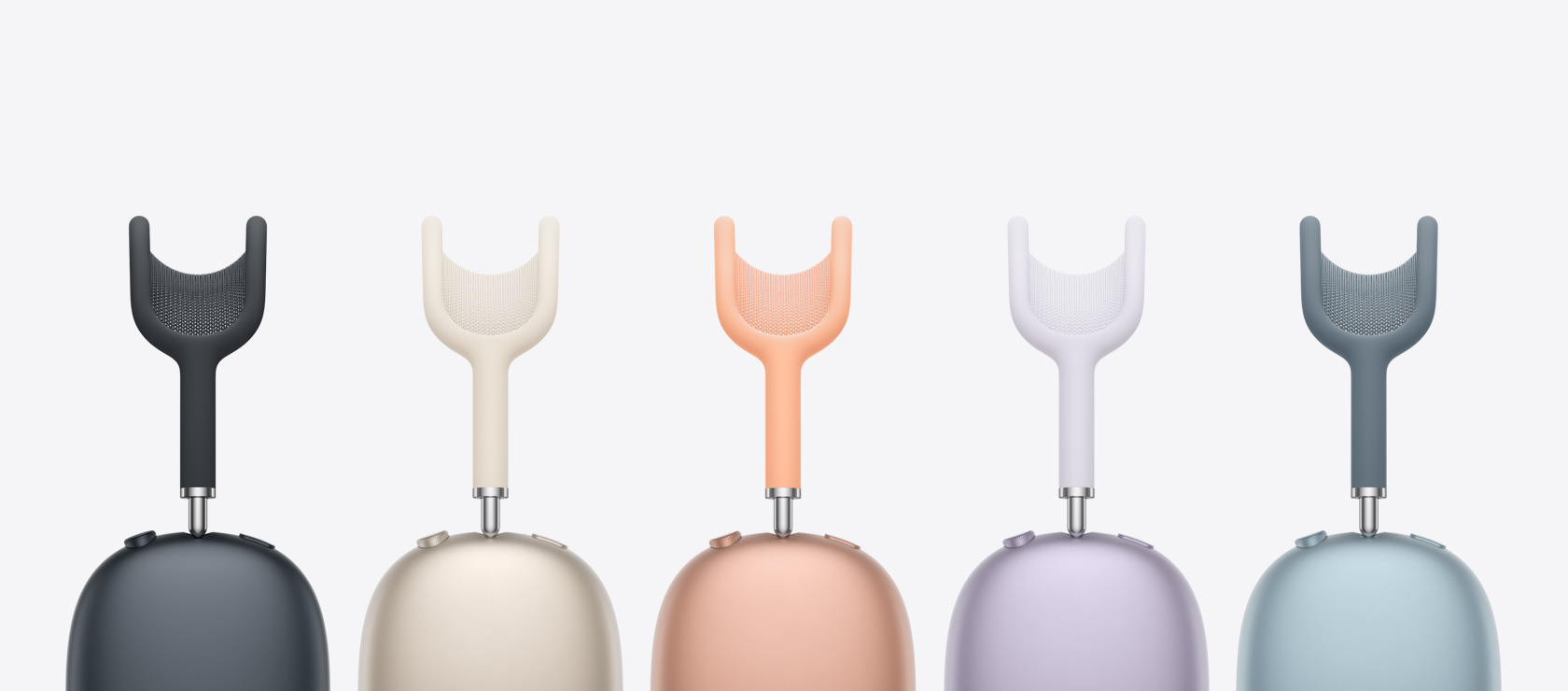 A side view of five AirPods Max models — the colours are Midnight, Starlight, Orange, Purple and Blue.