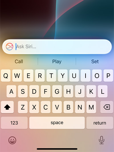 A text field at the top of keyboard in iPhone says Ask Siri