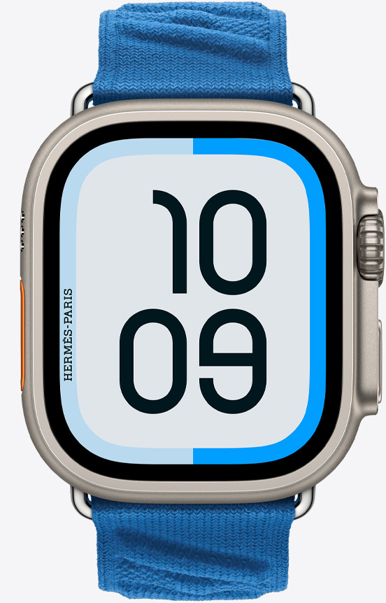 Front view of the Apple Watch Hermès Ultra 2 showing the Maritime watch face and new En Mer band in Bleu Hydra (marine blue).