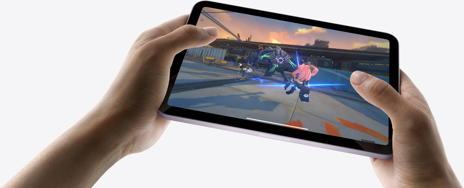 iPad mini held by a user's hands in landscape view playing a graphically intense game.